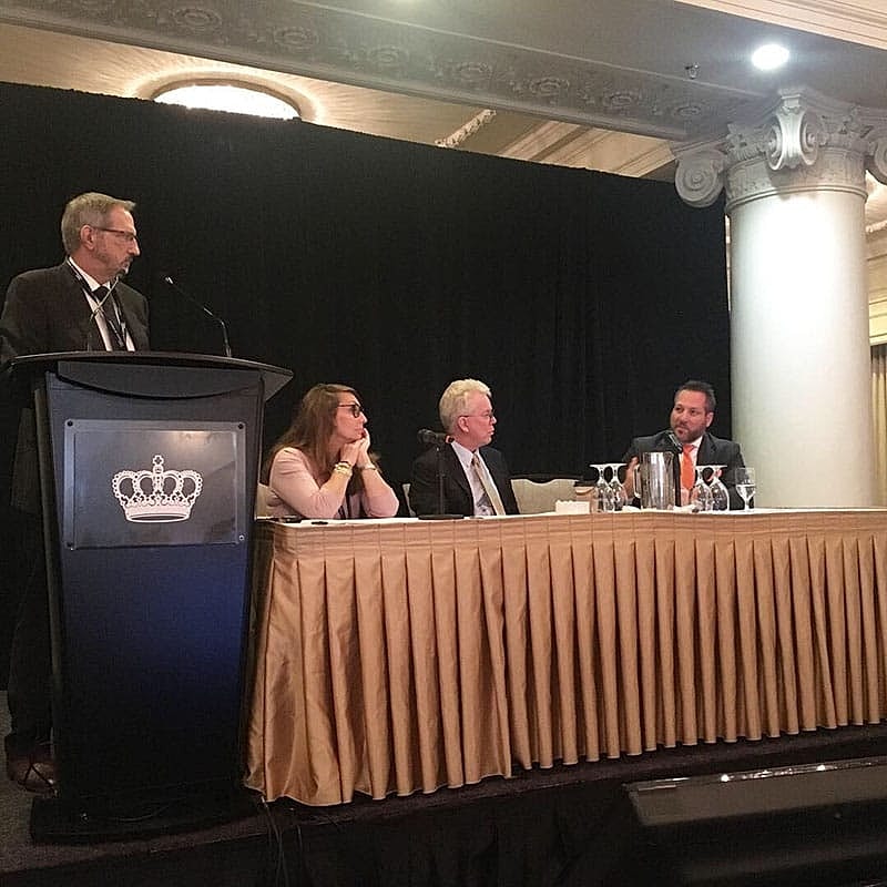 Panel discussion at a formal event.