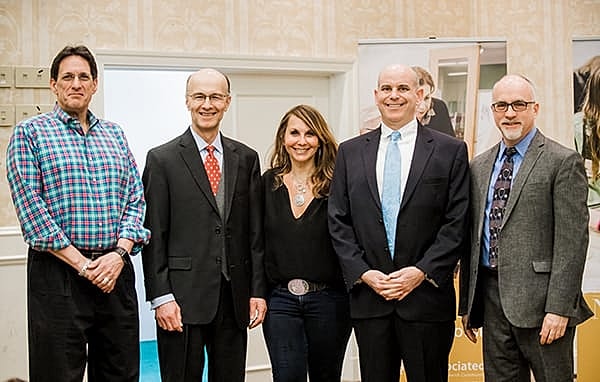 Group of professionals posing for a photo.