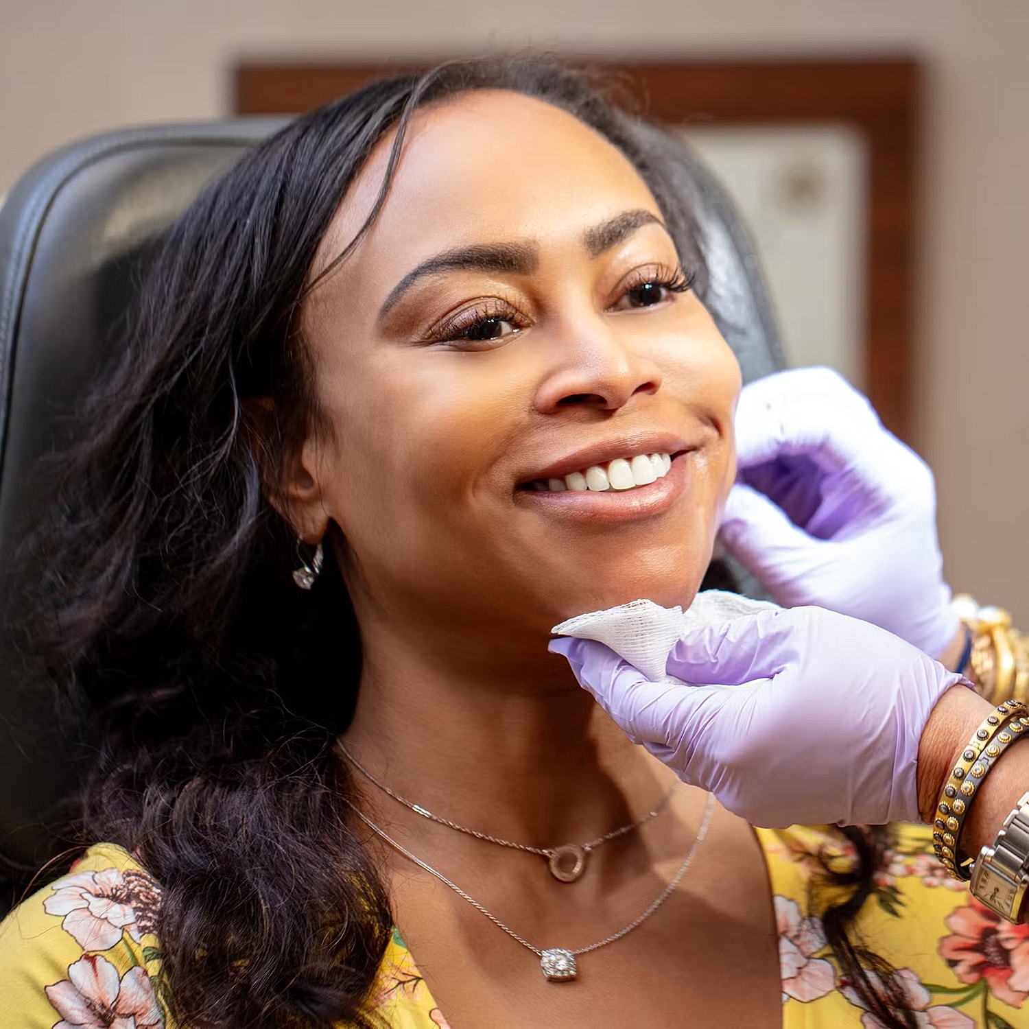 Model posing in a casual white outfit.