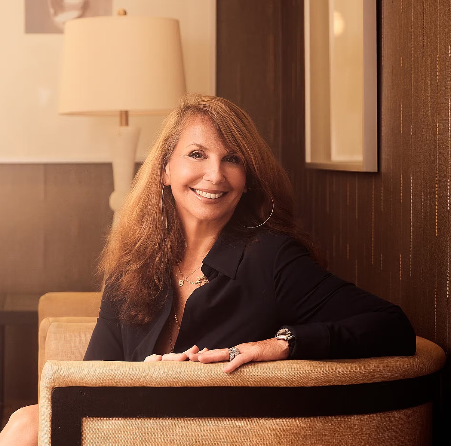Model in brown swimwear posing confidently.
