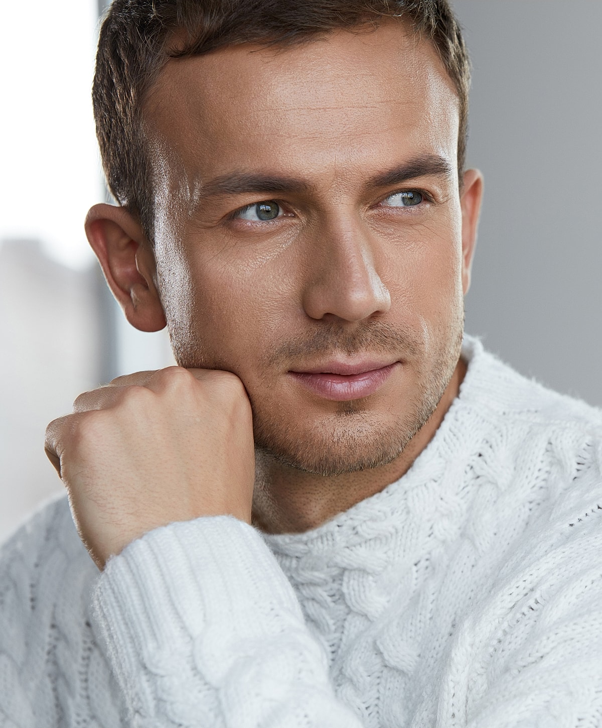 Model in brown swimwear posing confidently.