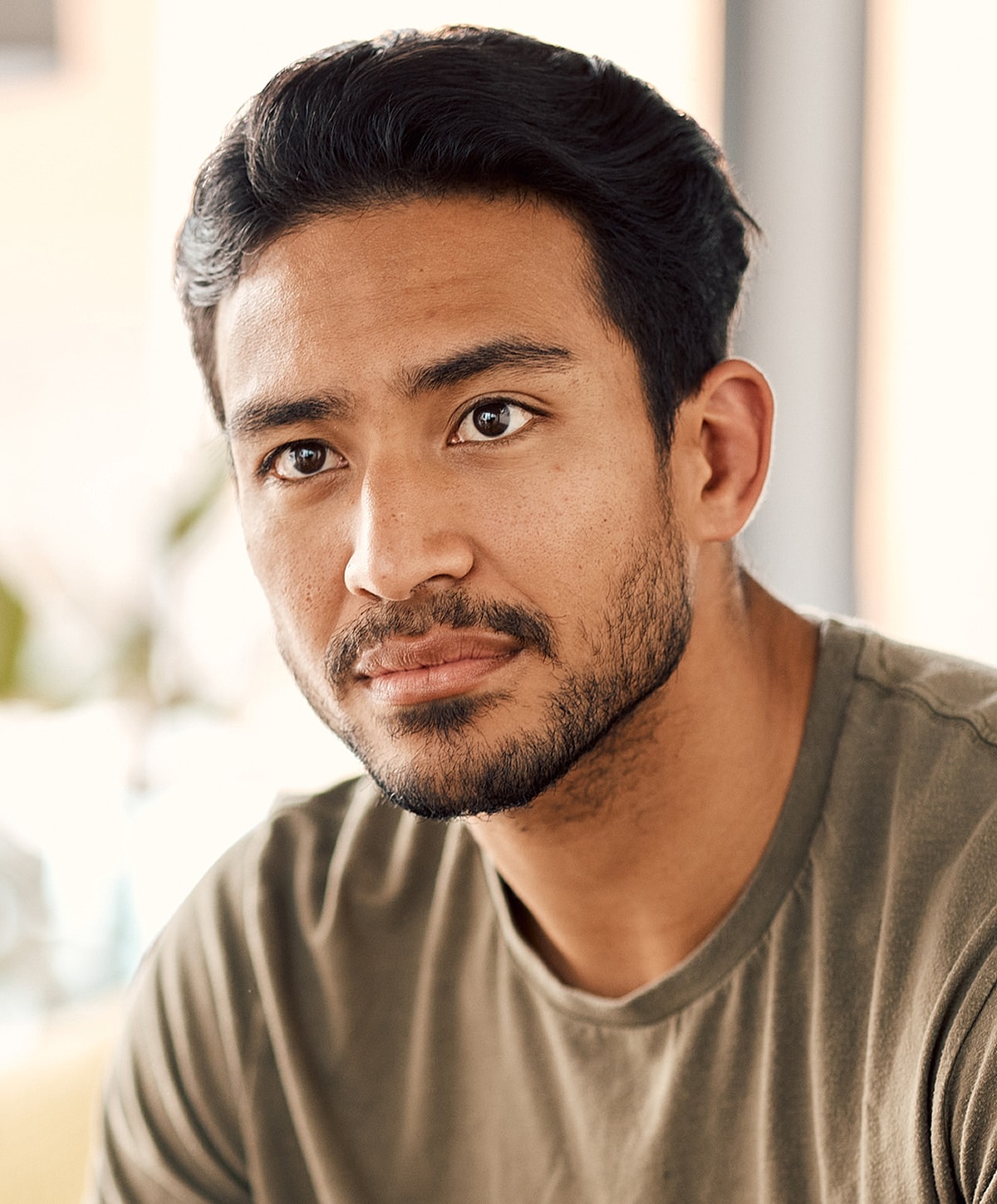 Model posing in a casual white outfit.