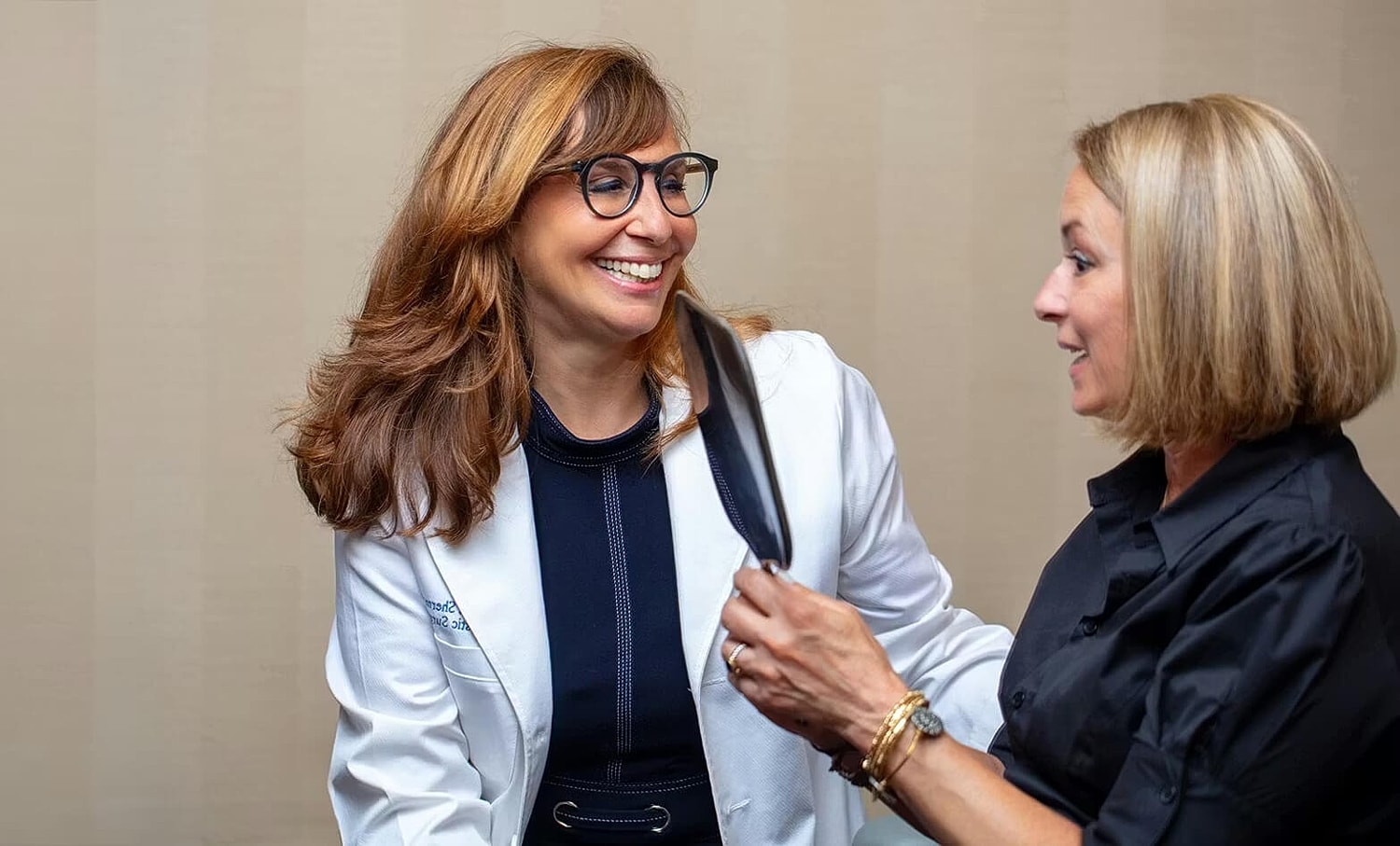 People reading and writing in a modern setting.