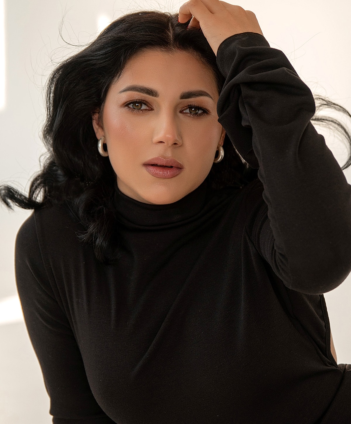 Model in brown swimwear posing confidently.