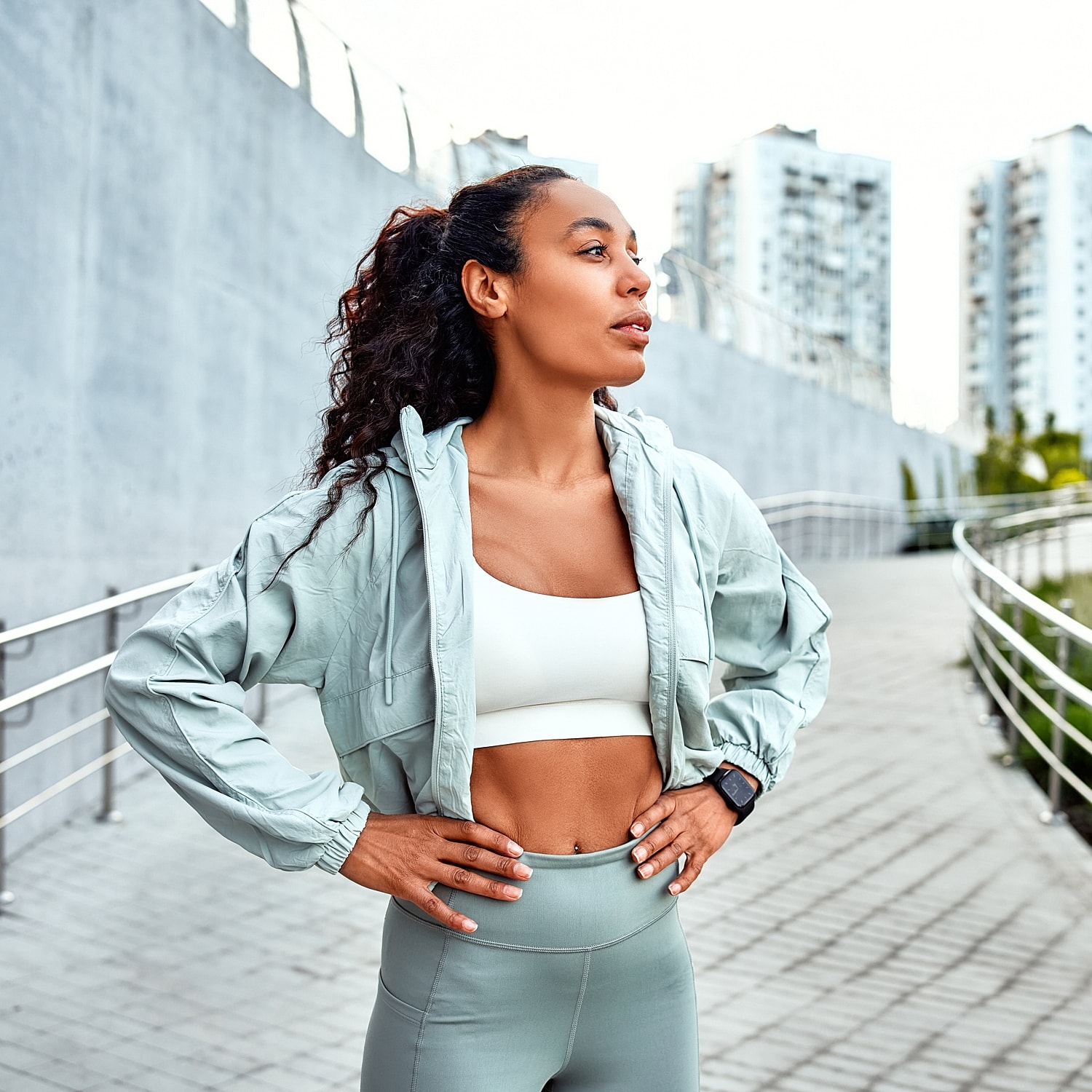 Model in brown swimwear posing confidently.