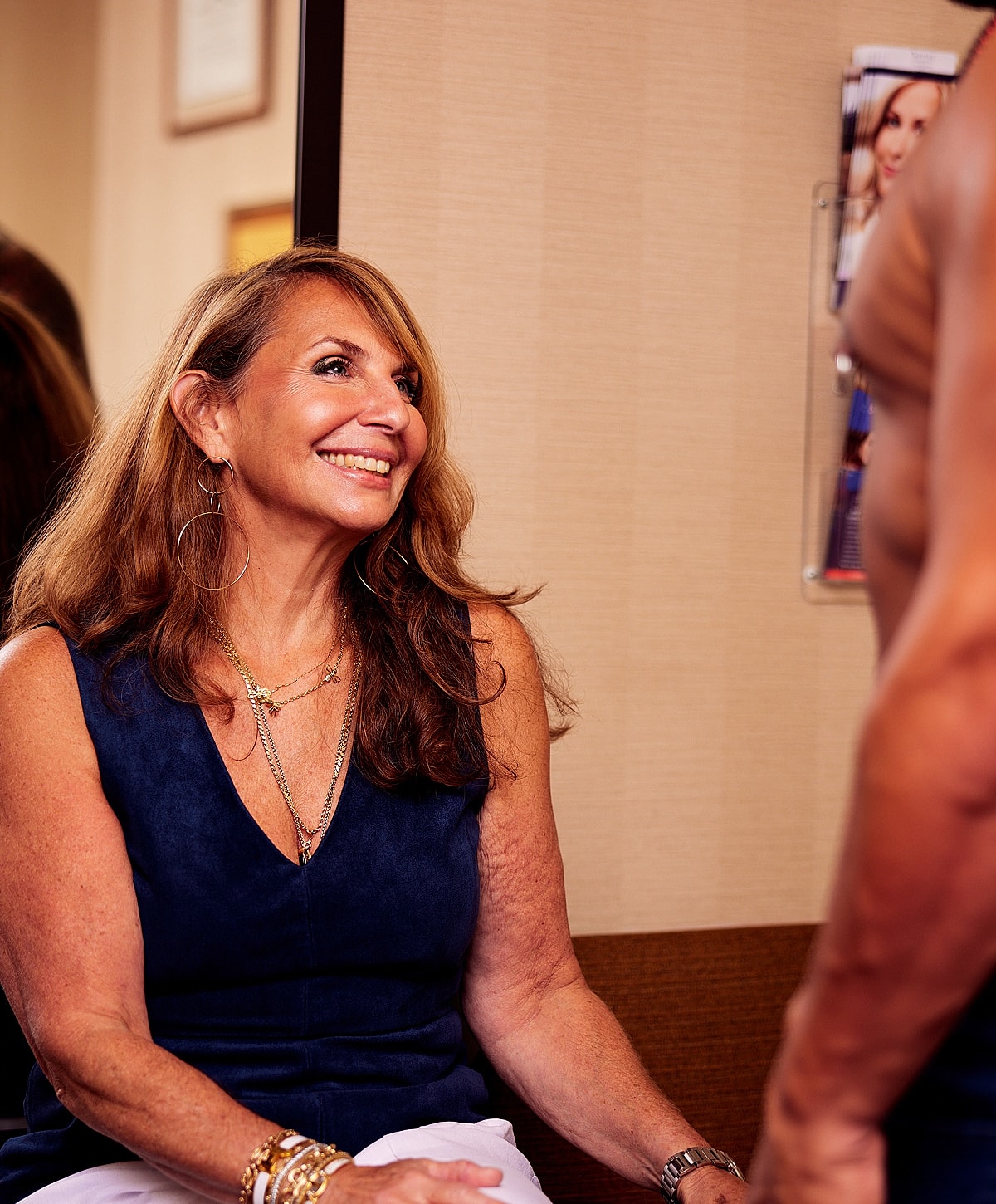 Model posing in a casual white outfit.