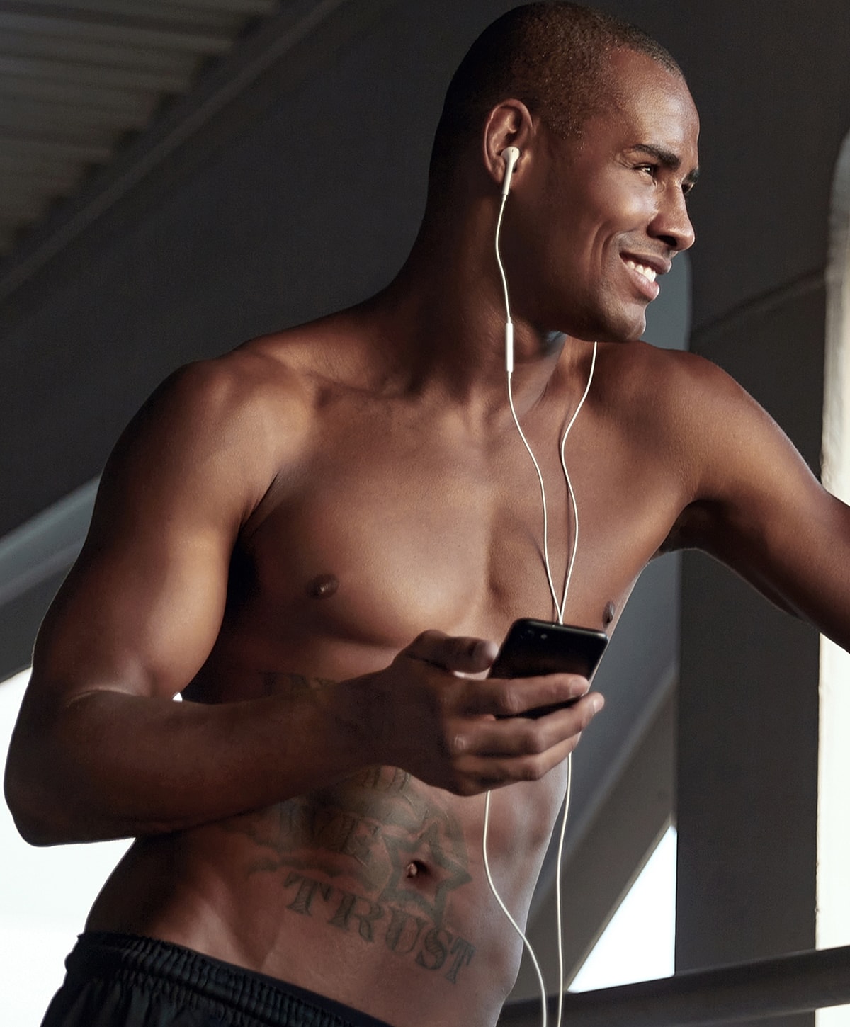 Model in brown swimwear posing confidently.