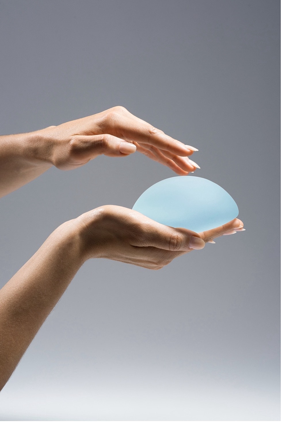 Model in brown swimwear posing confidently.