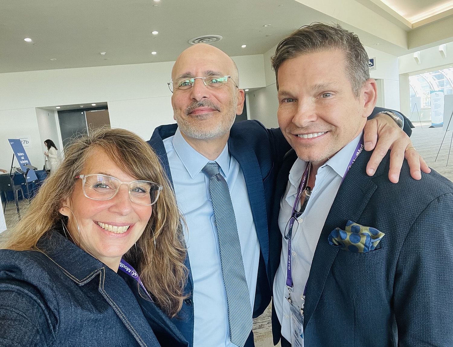Group selfie at a conference or event.
