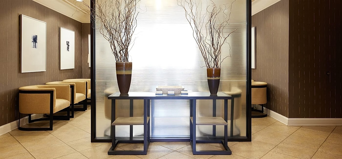 Modern interior with decorative vases and seating.